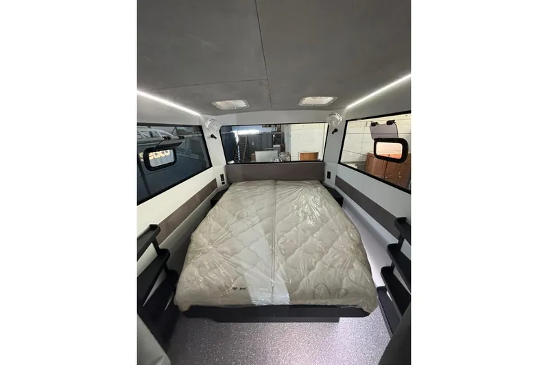 Sol Provider Yacht Photos Pics Interior of 2023 Hop Yacht 30, featuring a cozy bed and modern design.