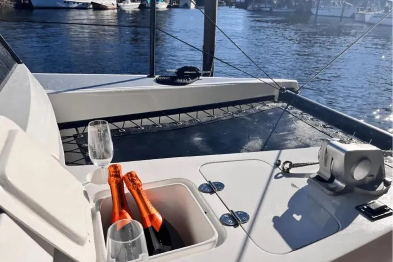 Sol Provider Yacht Photos Pics Hop Yacht 30 deck with champagne, glasses, and marina view, 2023 model.