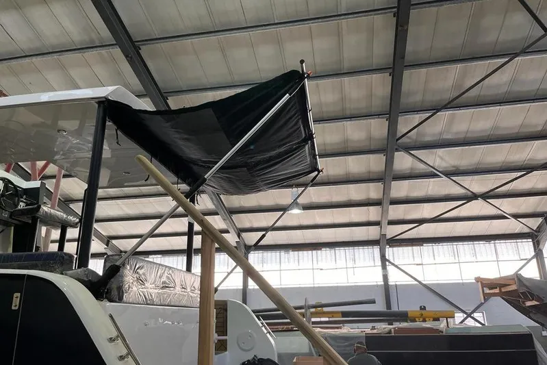 Sol Provider Yacht Photos Pics 2023 Hop Yacht 30 under construction in a spacious indoor facility.