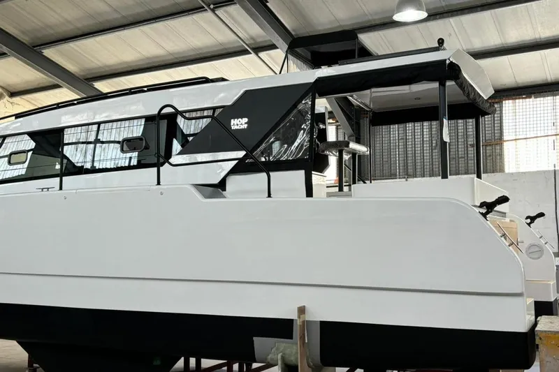 Sol Provider Yacht Photos Pics 2023 Hop Yacht 30 in a warehouse, showcasing sleek design and modern features.