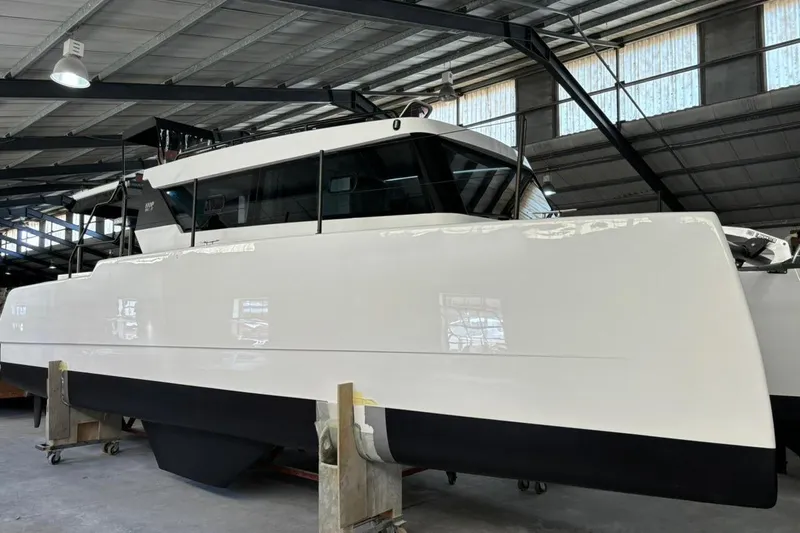 Sol Provider Yacht Photos Pics 2023 Hop Yacht 30 in a warehouse, showcasing sleek design and modern features.