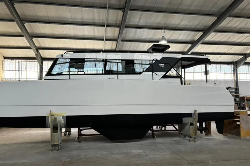 Sol Provider Yacht Photos Pics 2023 Hop Yacht 30 in a warehouse, showcasing sleek design and modern features.