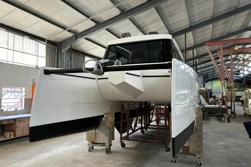 Sol Provider Yacht Photos Pics 2023 Hop Yacht 30 in a workshop, showcasing sleek design and modern construction.