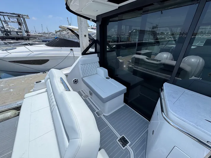 36 Xo Yacht Photos Pics 2026 Regal 36 XO yacht interior with sleek seating and modern design at a marina.