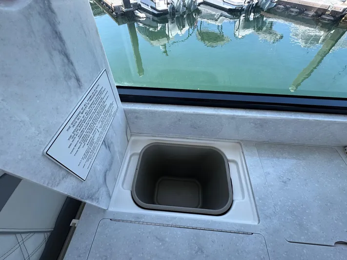 36 Xo Yacht Photos Pics 2026 Regal 36 XO boat interior with built-in sink and marina view.