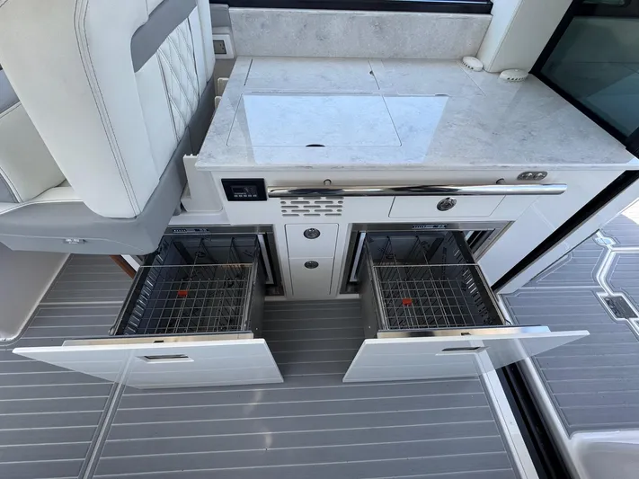 36 Xo Yacht Photos Pics 2026 Regal 36 XO yacht kitchen with open dual-drawer dishwashers and sleek countertop.