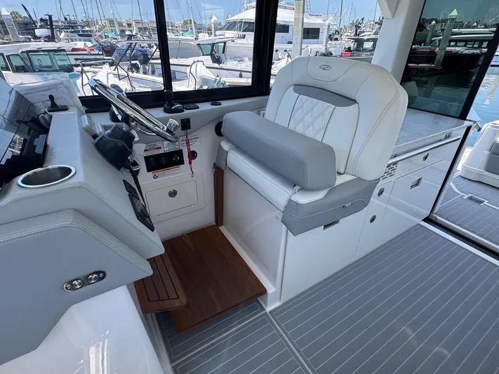 36 Xo Yacht Photos Pics Helm station of 2026 Regal 36 XO yacht with modern controls and seating.