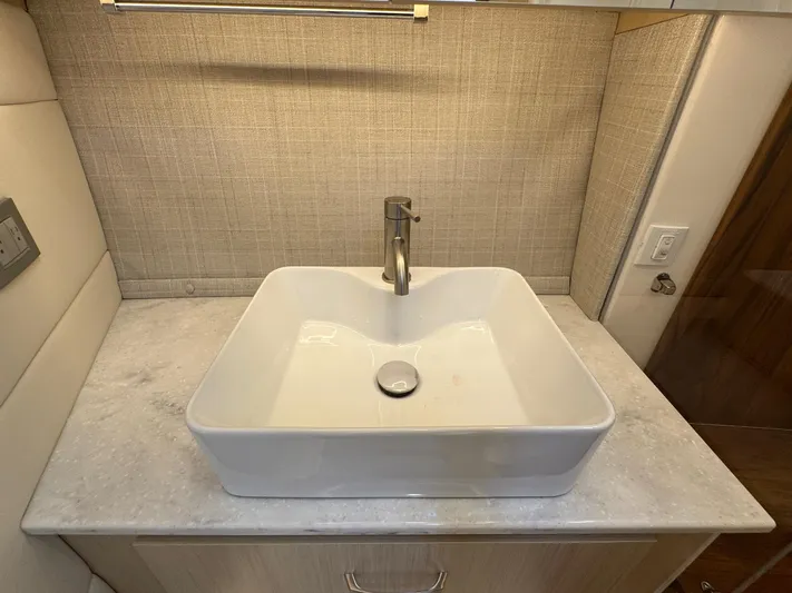 36 Xo Yacht Photos Pics Modern square sink on marble countertop in 2026 Regal 36 XO yacht bathroom.