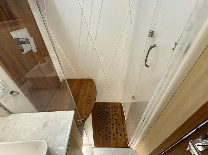 36 Xo Yacht Photos Pics Modern shower area in 2026 Regal 36 XO yacht with wooden accents.