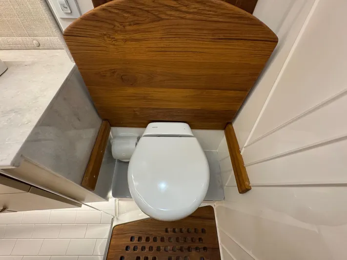 36 Xo Yacht Photos Pics Modern bathroom in 2026 Regal 36 XO yacht with wooden accents and sleek design.