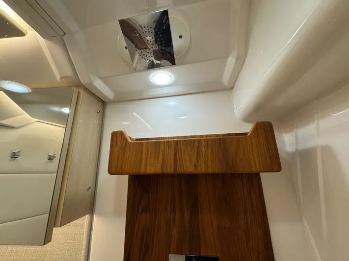36 Xo Yacht Photos Pics Interior of 2026 Regal 36 XO yacht featuring modern wood accents and lighting.