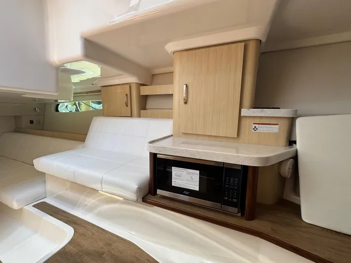 36 Xo Yacht Photos Pics Interior of 2026 Regal 36 XO yacht with modern seating and kitchenette.