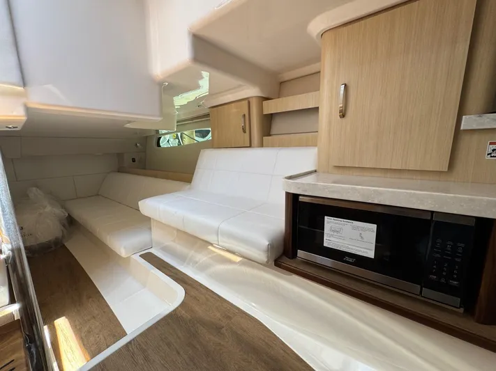 36 Xo Yacht Photos Pics Interior of 2026 Regal 36 XO yacht with modern seating and cabinetry.
