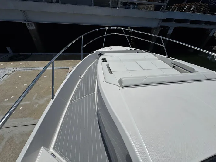 36 Xo Yacht Photos Pics 2026 Regal 36 XO yacht with sleek deck and sunbathing area.