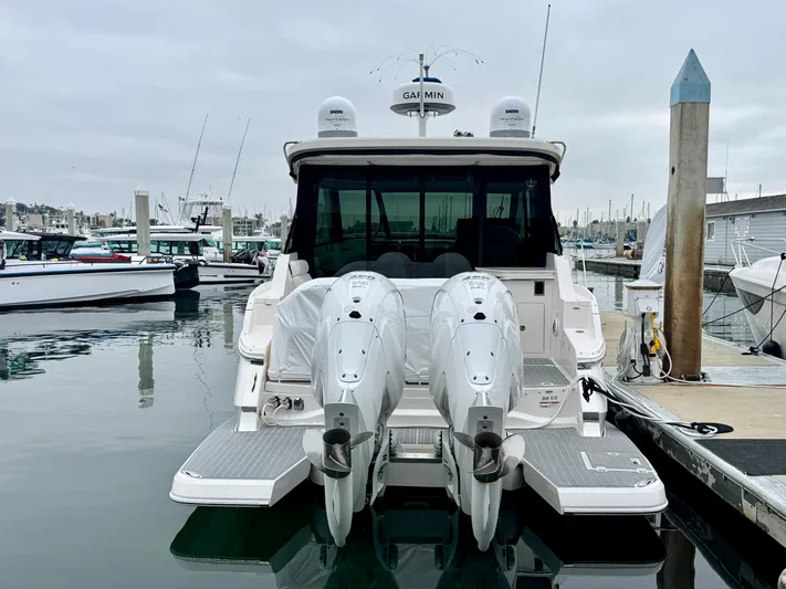 36 Xo Yacht Photos Pics 2026 Regal 36 XO yacht docked with twin outboard engines in a marina.