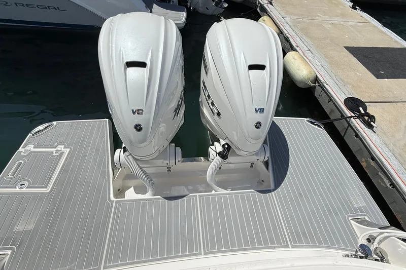36 Xo Yacht Photos Pics 2026 Regal 36 XO boat with twin V8 outboard engines at dock.