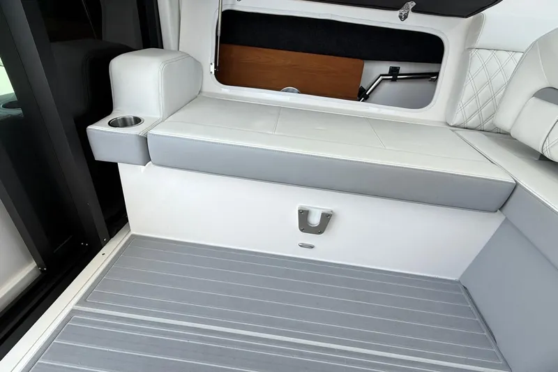 36 Xo Yacht Photos Pics 2026 Regal 36 XO boat interior with white seating and cup holder.