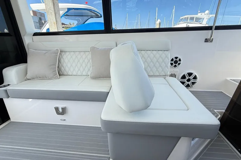 36 Xo Yacht Photos Pics Luxurious seating area on the 2026 Regal 36 XO yacht with elegant cushions.