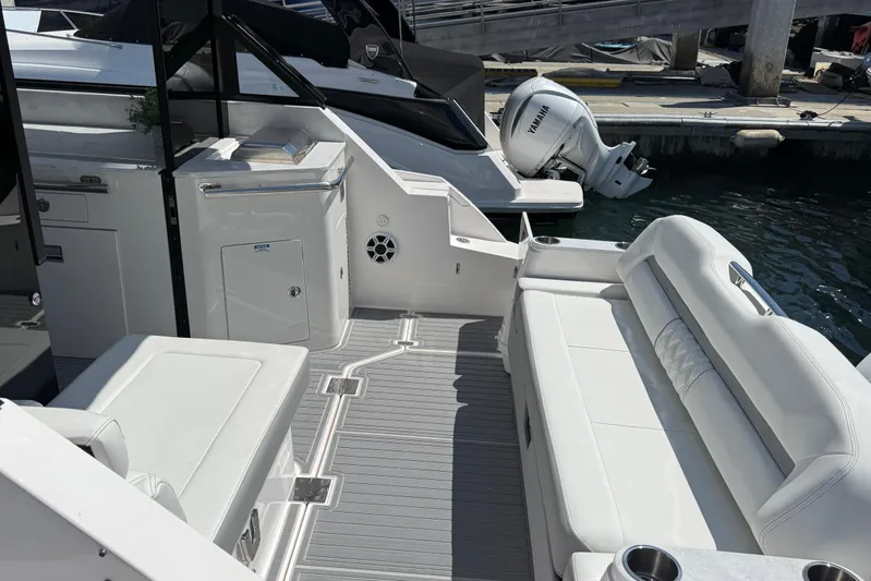36 Xo Yacht Photos Pics 2026 Regal 36 XO boat interior with white seating and Yamaha outboard motor.