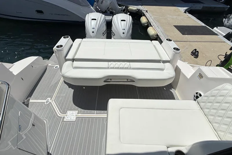 36 Xo Yacht Photos Pics 2026 Regal 36 XO boat interior with white seating and twin outboard engines.