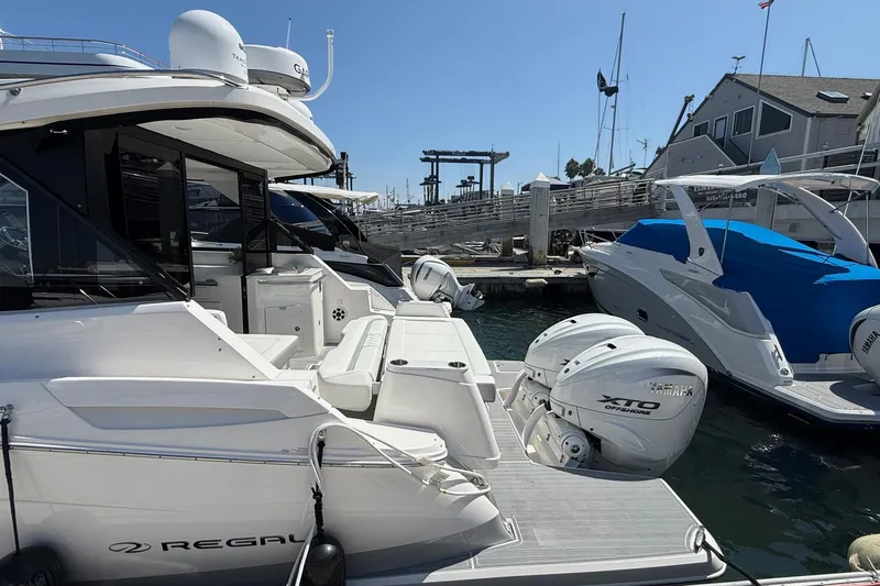 36 Xo Yacht Photos Pics 2026 Regal 36 XO yacht docked, featuring twin Yamaha XTO outboard engines.