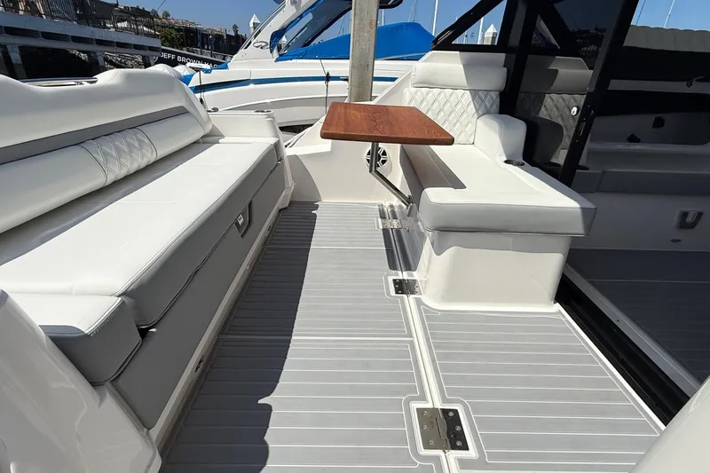 36 Xo Yacht Photos Pics Luxurious seating area on 2026 Regal 36 XO yacht with elegant wood table.