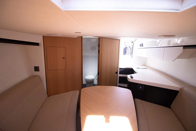  Yacht Photos Pics Interior of 2021 Fairline F Line 33 yacht with seating and bathroom.