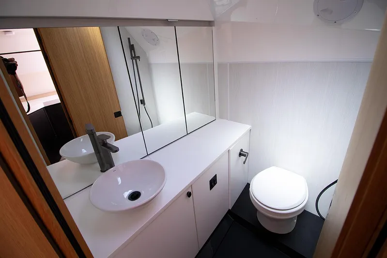 Yacht Photos Pics 2021 Fairline F Line 33 yacht bathroom with modern fixtures and sleek design.
