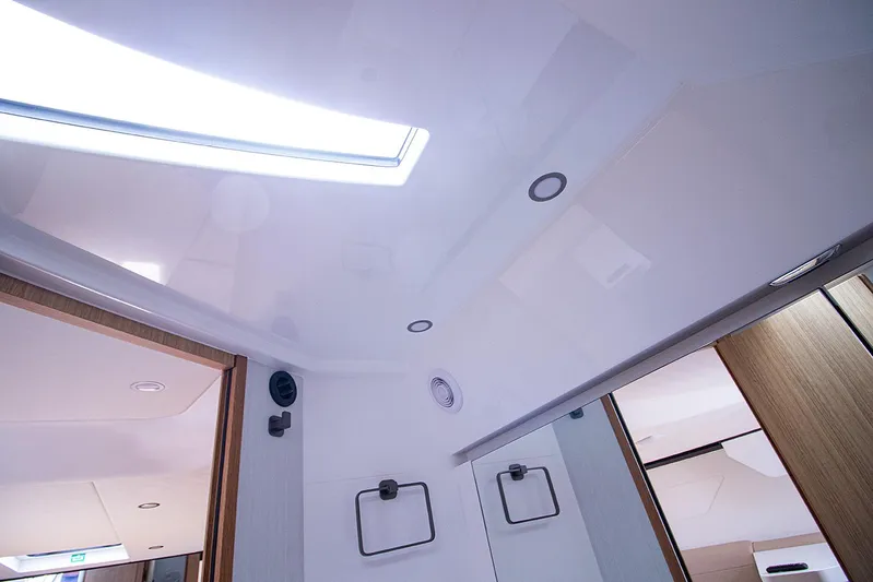  Yacht Photos Pics Interior ceiling of 2021 Fairline F Line 33 yacht with modern lighting.