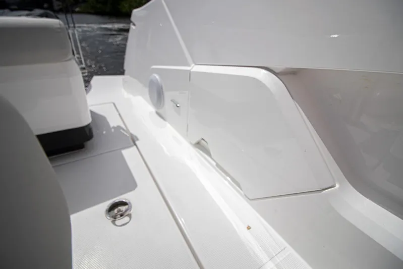  Yacht Photos Pics 2021 Fairline F Line 33 yacht deck detail with white seating and storage compartments.