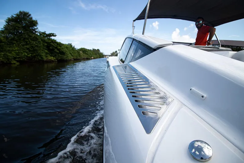  Yacht Photos Pics 2021 Fairline F Line 33 cruising on a river.