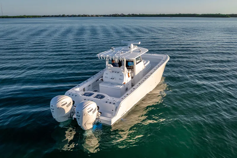  Yacht Photos Pics 2026 Freeman 35 boat with dual Yamaha engines cruising on calm water.