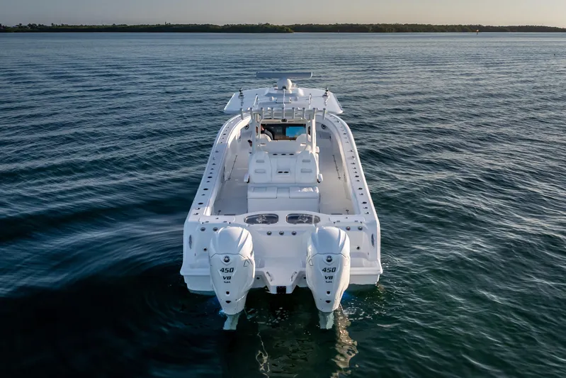  Yacht Photos Pics 2026 Freeman 35 boat on calm water, rear view with dual engines.
