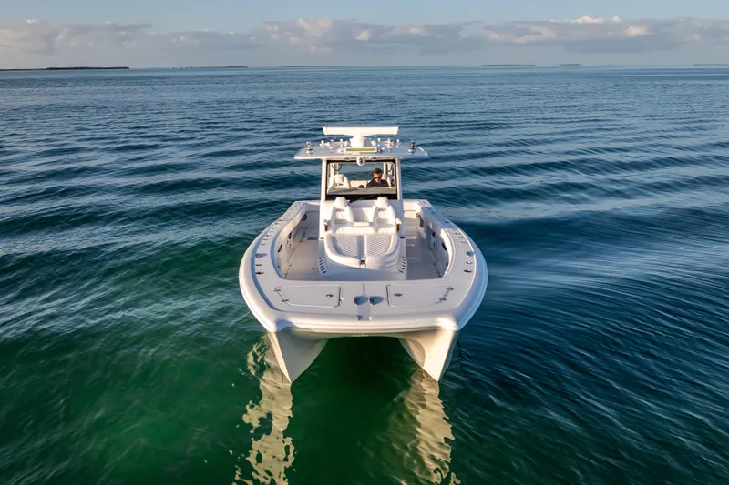  Yacht Photos Pics 2026 Freeman 35 boat cruising on calm ocean waters under a clear sky.