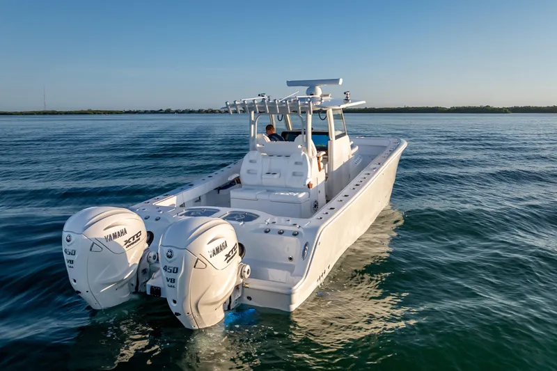  Yacht Photos Pics 2026 Freeman 35 boat with twin Yamaha 450 engines cruising on calm water.