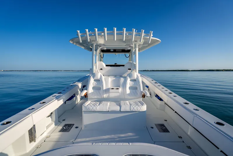  Yacht Photos Pics 2026 Freeman 35 boat on calm water, featuring sleek white seating and modern design.