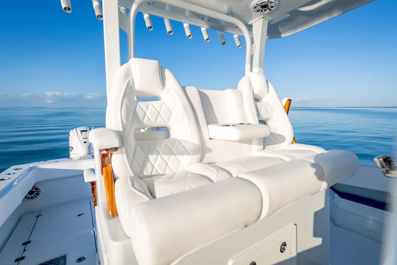  Yacht Photos Pics Luxurious seating on a 2026 Freeman 35 boat, with a serene ocean backdrop.