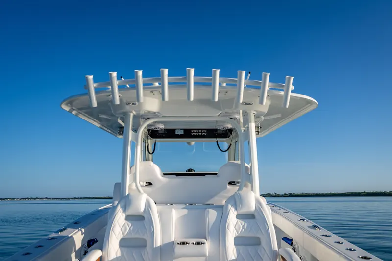  Yacht Photos Pics 2026 Freeman 35 boat with sleek design on calm water under clear blue sky.