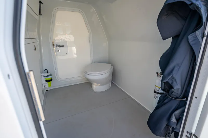  Yacht Photos Pics Modern bathroom interior in Freeman 35, 2026 model, featuring a sleek toilet and minimalistic design.