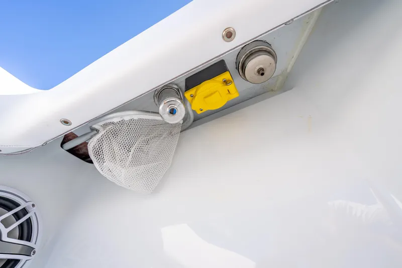  Yacht Photos Pics 2026 Freeman 35 boat detail with speaker, netting, and metal fixtures against blue sky.