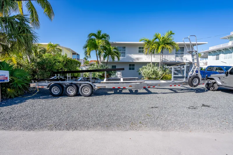  Yacht Photos Pics Trailer for Freeman 35, 2026 model, parked on gravel with tropical backdrop.