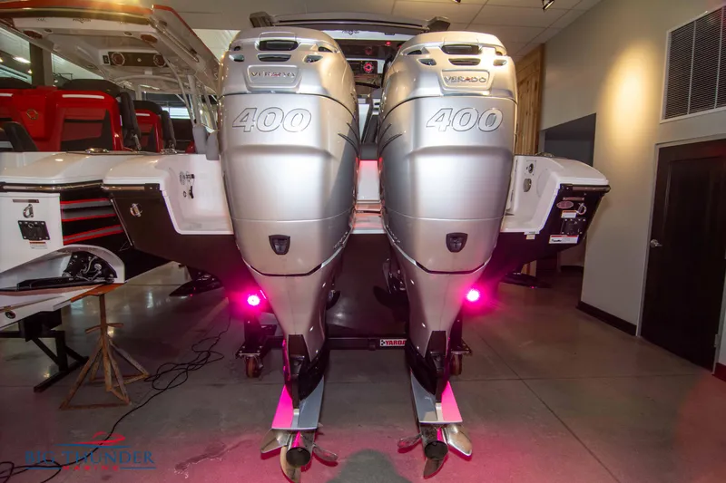  Yacht Photos Pics 2023 Fountain 34 SC boat with twin Mercury 400 outboard engines in showroom.