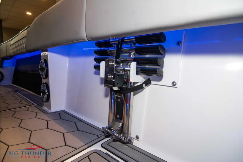  Yacht Photos Pics 2023 Fountain 34 SC boat interior with blue LED lighting and hexagonal floor design.