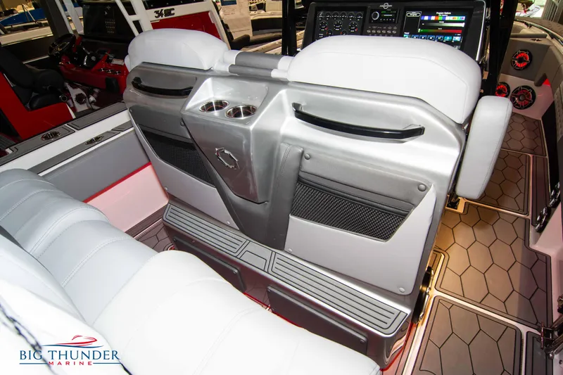  Yacht Photos Pics 2023 Fountain 34 SC boat interior with white seats and modern dashboard.