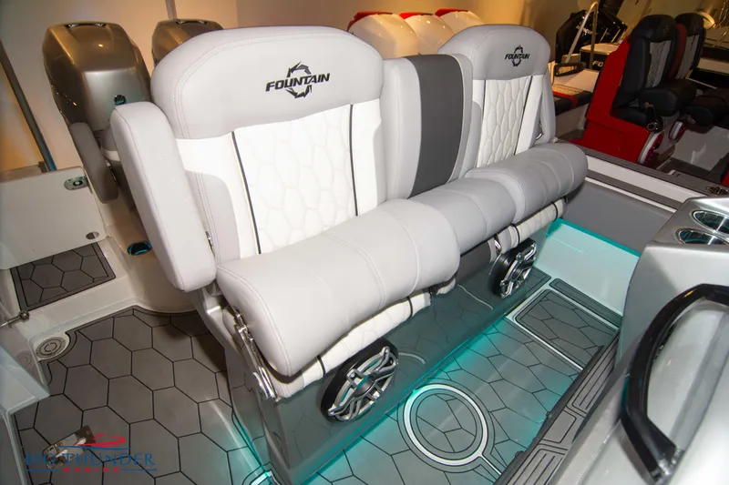  Yacht Photos Pics 2023 Fountain 34 SC boat interior with dual cushioned seats and modern design.