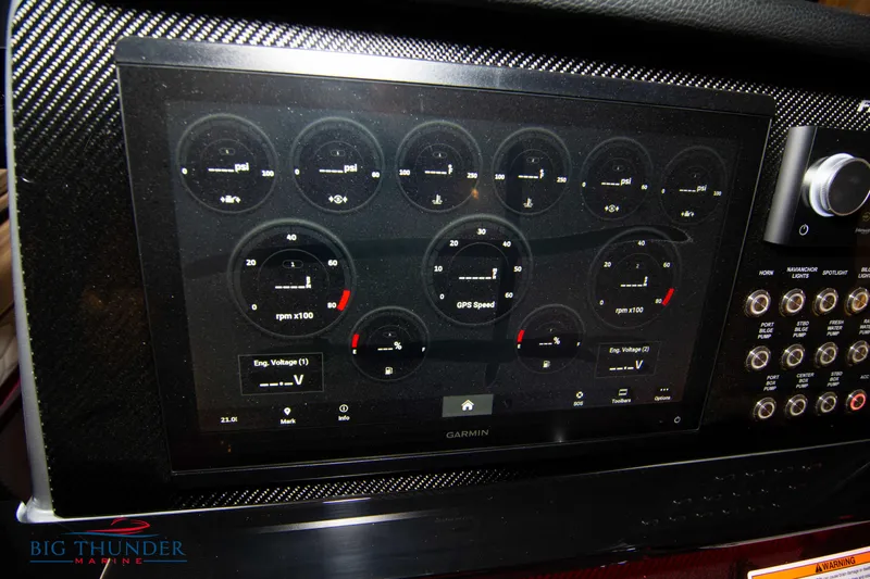  Yacht Photos Pics 2023 Fountain 34 SC boat dashboard with Garmin display and control panel.