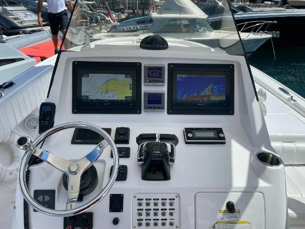  Yacht Photos Pics Helm of 2013 Intrepid 327 OPEN boat with navigation screens and controls.