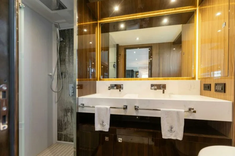  Yacht Photos Pics Luxurious bathroom in 2018 Cruisers Yachts 60 Fly, featuring modern fixtures and elegant design.