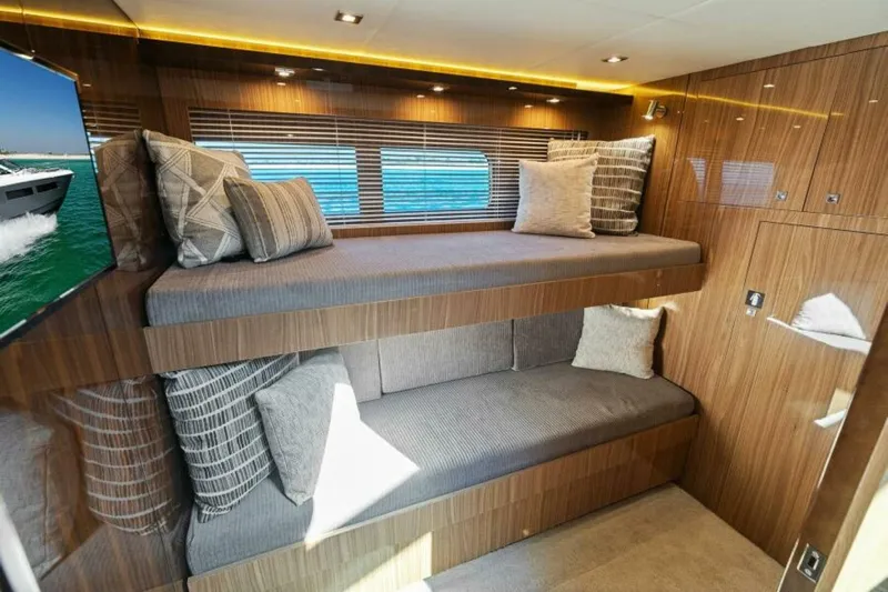  Yacht Photos Pics Luxurious 2018 Cruisers Yachts 60 Fly cabin with modern wood finish and cozy bedding.