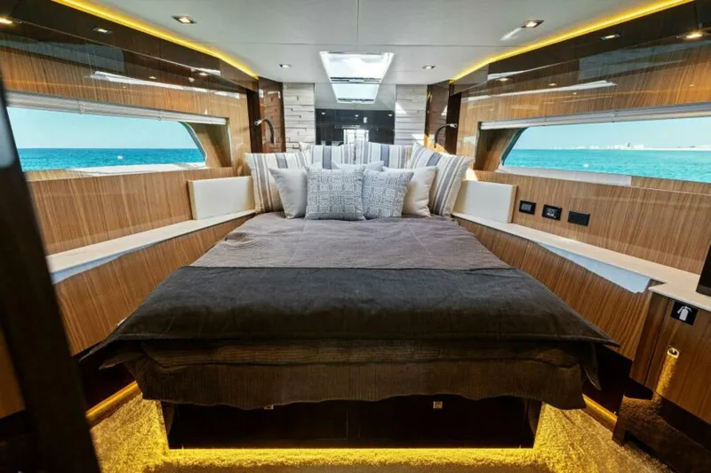  Yacht Photos Pics Luxurious interior of 2018 Cruisers Yachts 60 Fly with ocean view and elegant bedding.